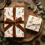 Luxury puppy dog wrapping paper with velvet ribbon on rustic gift boxes by Wrapped Studios.