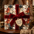 Fantasy dragon wrapping paper with floral design and red velvet ribbon by Wrapped Studios.