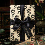 Chinese dragon wrapping paper with black satin ribbon, luxury gift wrap by Wrapped Studios.