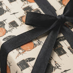 Vintage drum wrapping paper with a black bow, perfect for musician gifts. By Wrapped Studios.