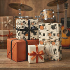 Drummer wrapping paper with drum kit illustrations on gift boxes with ribbons by Wrapped Studios.