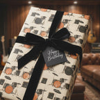 Vintage drum kit birthday wrapping paper with a black velvet bow by Wrapped Studios.