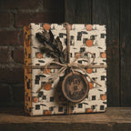 Drum kit music wrapping paper with rustic twine for musician gifts, by Wrapped Studios.
