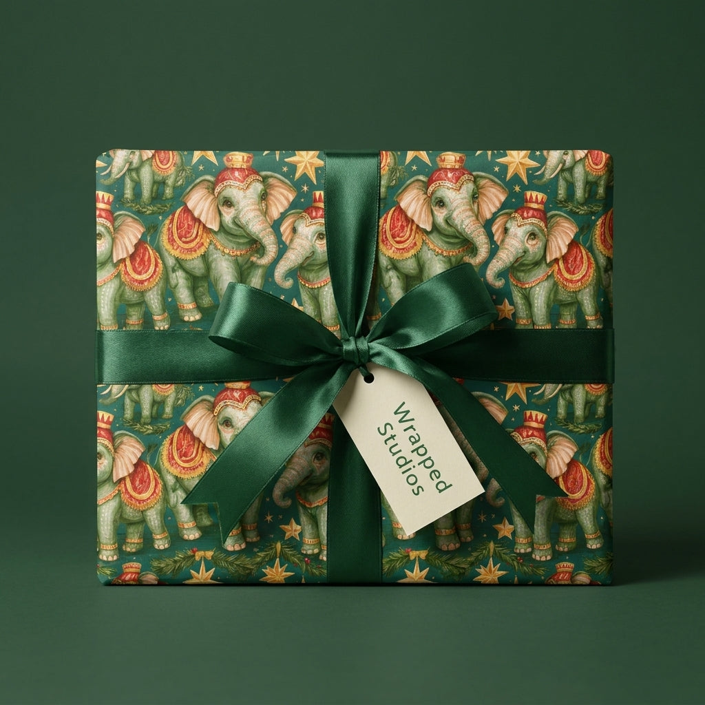 Vintage elephant Christmas wrapping paper with a green satin bow by Wrapped Studios.