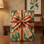Vintage elephant Christmas wrapping paper with a gold and red striped bow by Wrapped Studios.