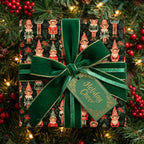 Vintage elf Christmas wrapping paper with luxury green velvet ribbon and tag by Wrapped Studios.