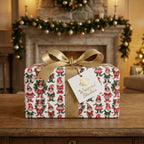 Vintage elf Christmas gift wrap by Wrapped Studios on a present with a gold bow by a cozy fireplace.