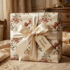 Luxury vintage floral Christmas wrapping paper with cream satin bow and gift tag by Wrapped Studios.