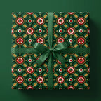 Luxury Christmas wrapping paper in green and gold geometric floral pattern with ribbon by Wrapped Studios.
