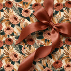 Vintage boho floral wrapping paper with terracotta roses and satin ribbon, luxury gift wrap by Wrapped Studios.