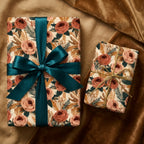 Luxury vintage floral wrapping paper with terracotta roses and a teal ribbon by Wrapped Studios.