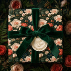 Luxury vintage floral wrapping paper with a green velvet bow and gift tag by Wrapped Studios.
