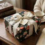 Luxury vintage floral wrapping paper with a white silk ribbon and "Love" heart tag by Wrapped Studios.