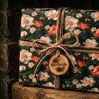 Vintage floral wrapping paper on a gift box with rustic twine and a handmade tag by Wrapped Studios.