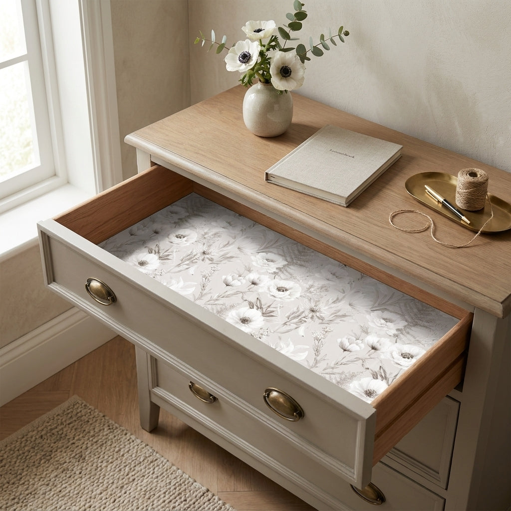 Elegant neutral floral wrapping paper used as a dresser drawer liner, by Wrapped Studios.