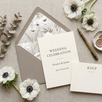 Elegant wedding invitation and floral envelope liner with white anemones by Wrapped Studios.