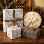 Elegant cream and taupe vintage floral wrapping paper on gifts with velvet ribbons by Wrapped Studios.