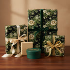 Elegant floral gift wrap from Wrapped Studios: Dark wrapping paper with roses and decorative ribbons.