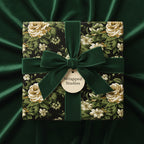 Elegant floral wrapping paper in vintage style with dark green velvet ribbon, Wrapped Studios.