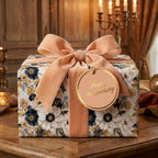 Luxury floral wrapping paper on an anniversary gift with a peach velvet bow by Wrapped Studios.