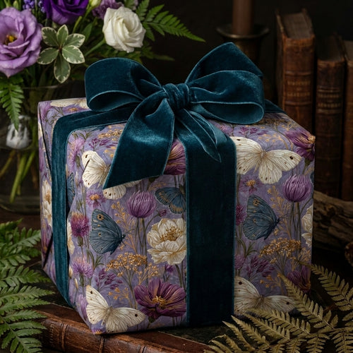 Luxury botanical wrapping paper with purple flowers, butterflies, and velvet ribbon by Wrapped Studios.