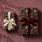 Luxury dark floral wrapping paper with velvet and satin bows by Wrapped Studios.