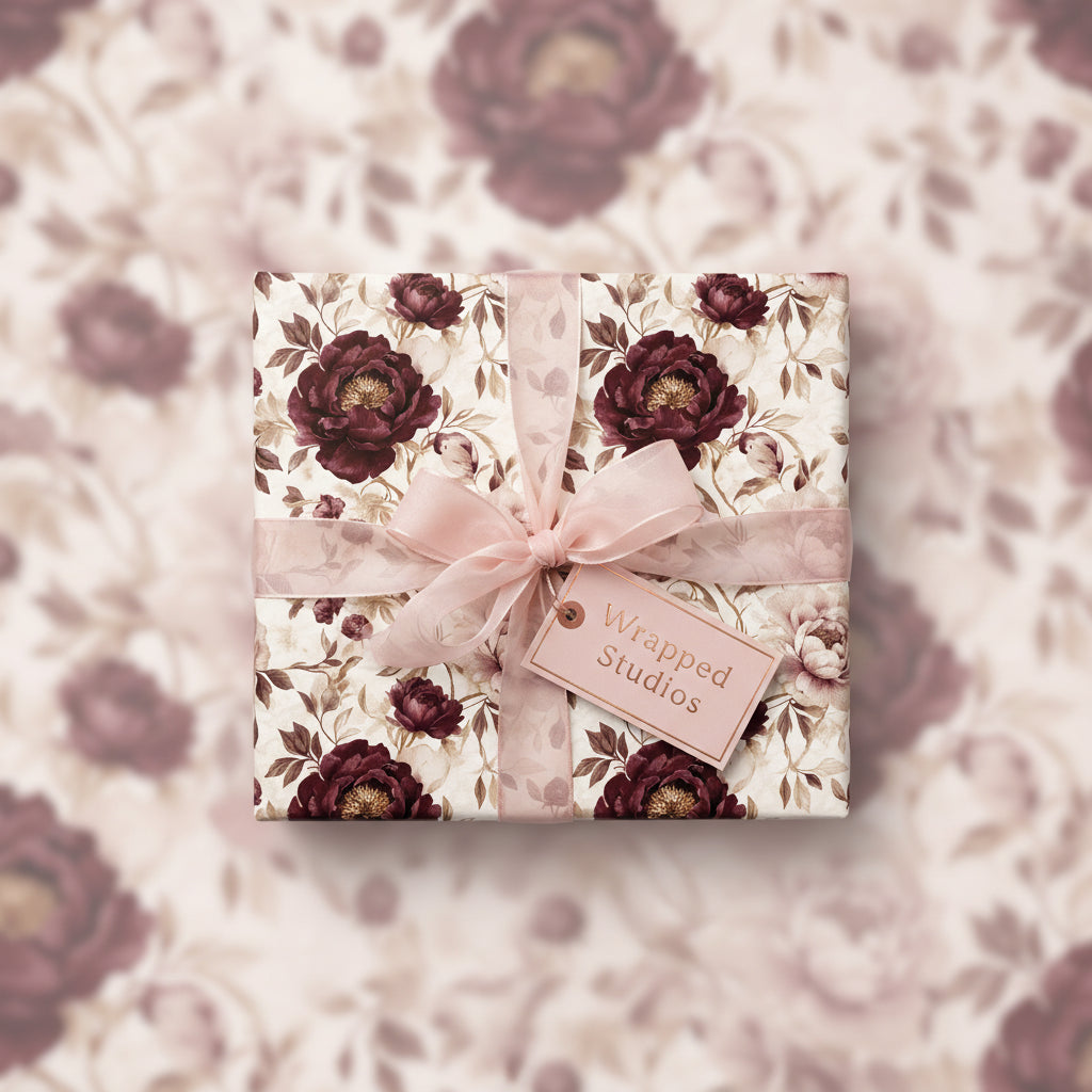 Elegant floral wrapping paper with burgundy peonies, light pink ribbon and gift tag.