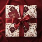 Elegant gift with floral wrapping paper, tied with a red satin bow and a "With Love" card.