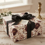 Elegant floral wrapping paper with a black ribbon and "Always & Forever" tag, perfect for a wedding or anniversary gift.