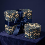 Two vintage floral patterned gift boxes with ribbons on a dark blue background. Luxury gift wrap.