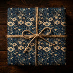 Elegant gift wrapped in navy floral wrapping paper with jute twine bow.