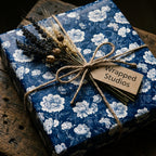 Vintage navy blue floral wrapping paper with rustic twine and lavender by Wrapped Studios.