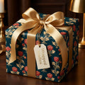 Luxury vintage floral wrapping paper in teal and red with a gold ribbon and Wrapped Studios gift tag.