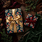 Luxury vintage floral wrapping paper with elegant gold and red velvet bows by Wrapped Studios.