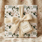 Elegant blush and sage floral wrapping paper with a cream velvet bow by Wrapped Studios.