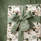 Luxury floral birthday wrapping paper with a sage green ribbon and gift tag by Wrapped Studios.