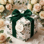 Elegant floral wedding wrapping paper with an emerald velvet bow by Wrapped Studios.