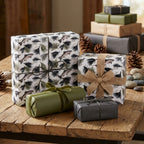 Rustic fly fishing wrapping paper with trout pattern and burlap bow by Wrapped Studios.