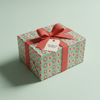 Modern mint green and coral oval pattern gift wrap with a peach ribbon and tag, perfect for birthday or baby shower presents.