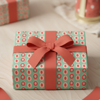 Modern mint green and coral polka dot gift wrap with a coral ribbon bow, perfect for a chic birthday or baby shower present.