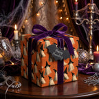 Spooky ghost Halloween wrapping paper with a luxury purple velvet bow and bat tag by Wrapped Studios.