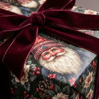 Vintage Santa Claus Christmas wrapping paper with luxury burgundy velvet ribbon bow by Wrapped Studios.