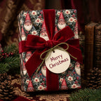 Luxury vintage Santa Christmas wrapping paper with a red velvet bow by Wrapped Studios.