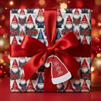 Festive gnome Christmas gift wrap with a red satin bow and Santa hat tag, by Wrapped Studios.