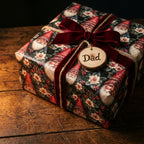 Vintage Santa Christmas wrapping paper with a red velvet ribbon and wooden Dad tag by Wrapped Studios.