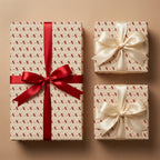 Graduation wrapping paper with diploma scroll pattern and elegant satin bows by Wrapped Studios.