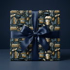 Luxury gift box wrapped in scholarly owl, book, and graduation cap paper with a deep blue satin ribbon by Wrapped Studios.