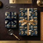Graduation gift wrap by Wrapped Studios featuring an academic owl, book, and cap pattern in navy and gold.