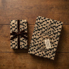 Vintage graduation wrapping paper with retro photo print and brown velvet bow by Wrapped Studios.
