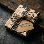 Rustic graduation wrapping paper with an Achievement Unlocked tag and twine bow by Wrapped Studios.